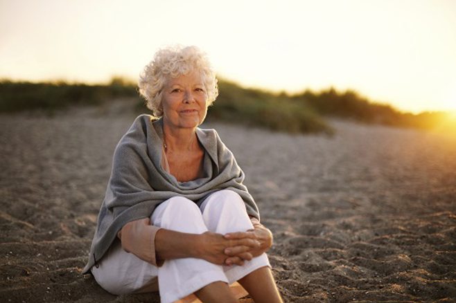 Woman sitting on the beach Woman sitting on the beach
